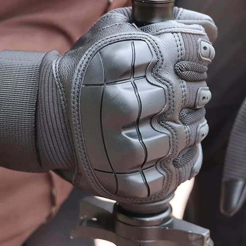 A Ruck & Recon glove gripping a tool handle